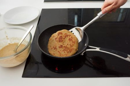 Flipping pancake with a spatular.