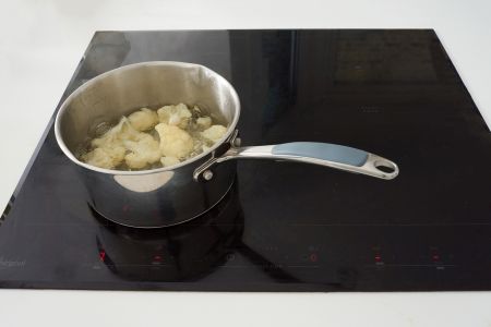 Cauliflower boiling on the hob.