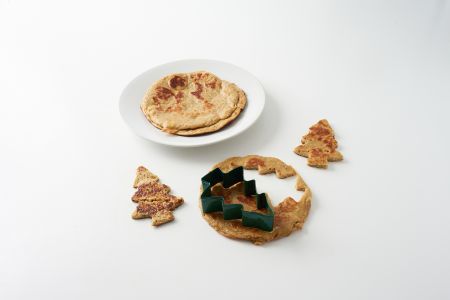 Tree shaped stencil cutting pancakes